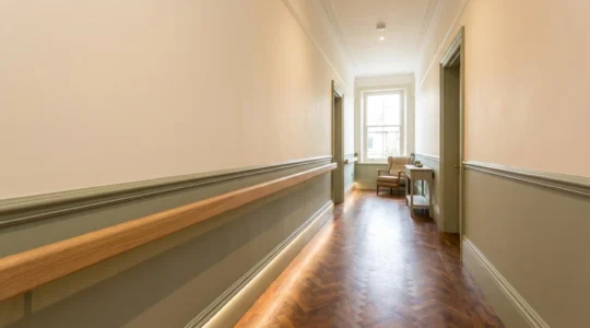 Elegant Victorian terrace hallway adapted for senior living with integrated safety features and natural lighting